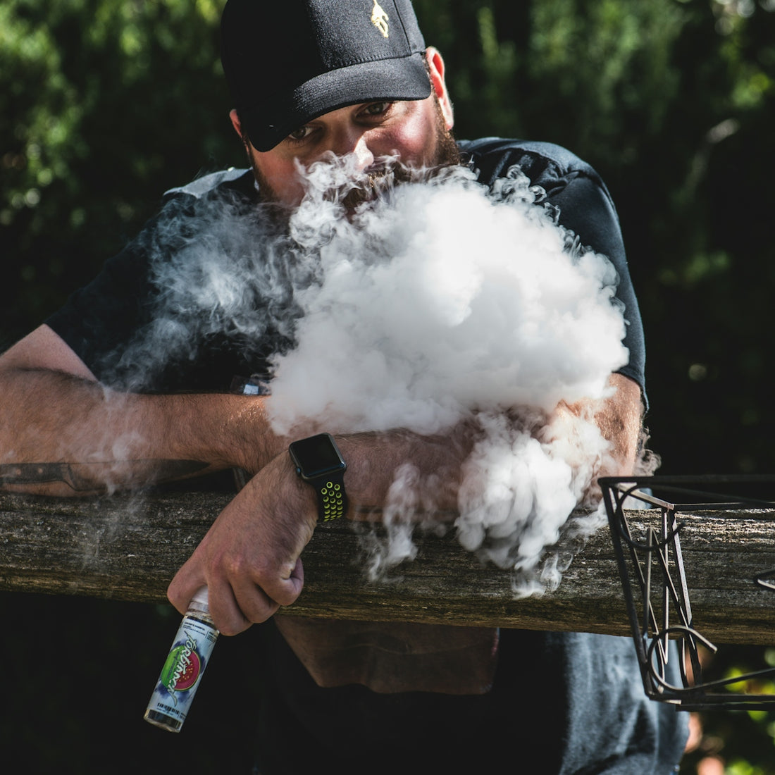 man smoking vape