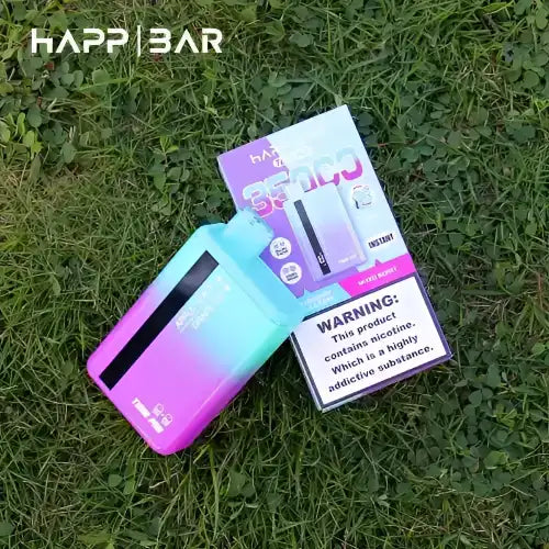 En färgglad vape-enhet med gradient och dess förpackning.